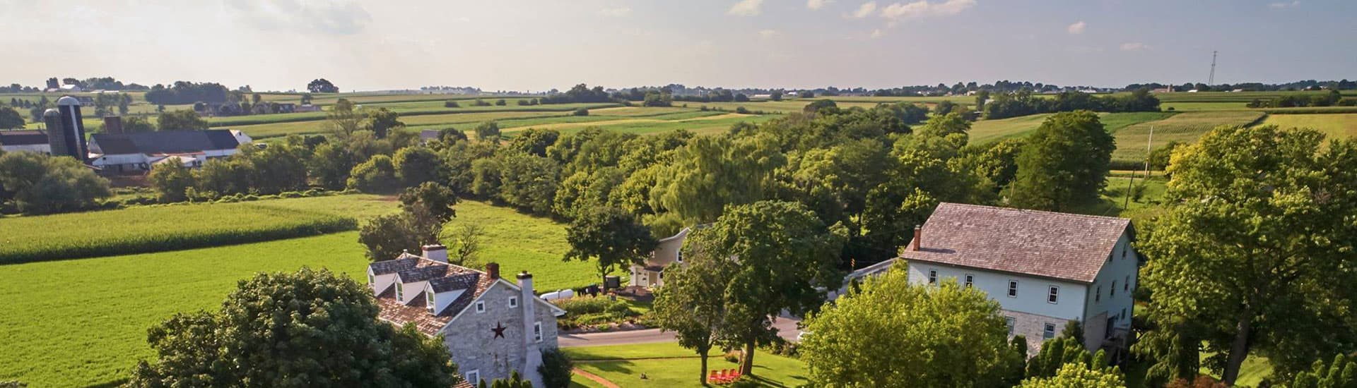 Aerial view of Osceola Mill House with farms and fields in background