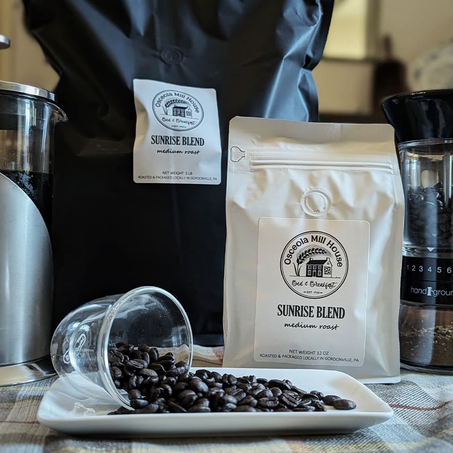 Bags of fresh coffee beans on branded bags